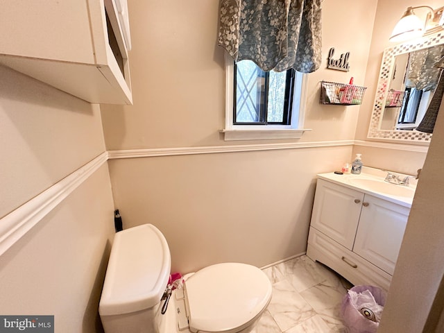 bathroom with vanity and toilet