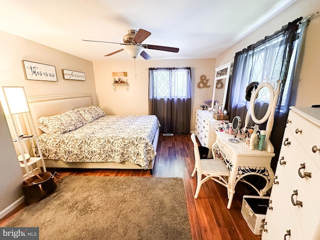 bedroom featuring dark wood-type flooring and ceiling fan