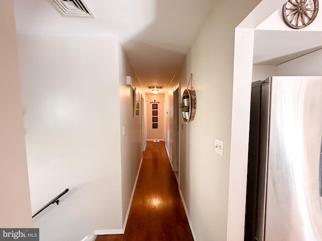 hall featuring dark wood-type flooring