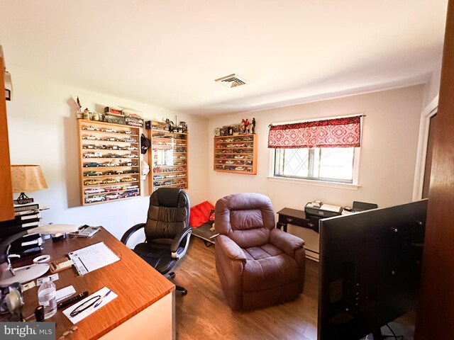 office space with hardwood / wood-style flooring