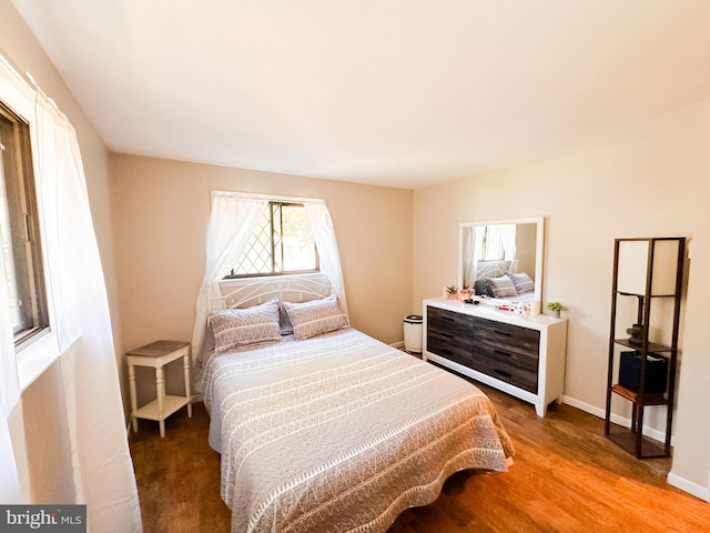 bedroom with wood-type flooring