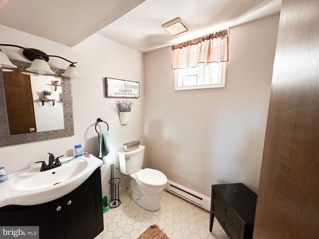 bathroom featuring vanity, toilet, and a baseboard radiator