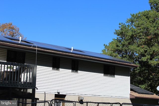 view of home's exterior featuring solar panels