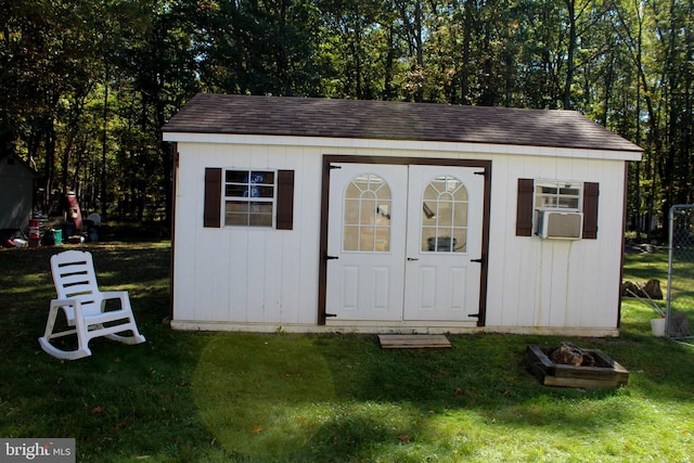 view of outdoor structure featuring a yard