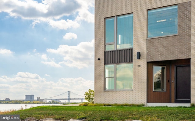 view of building exterior with a water view