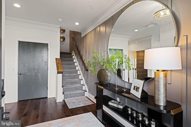 entryway with crown molding and dark hardwood / wood-style floors