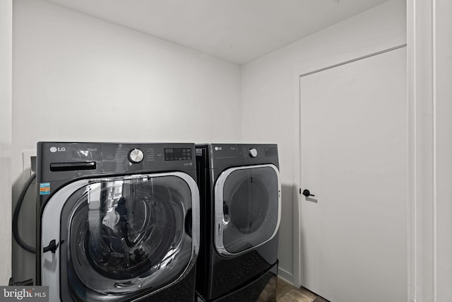 washroom with separate washer and dryer