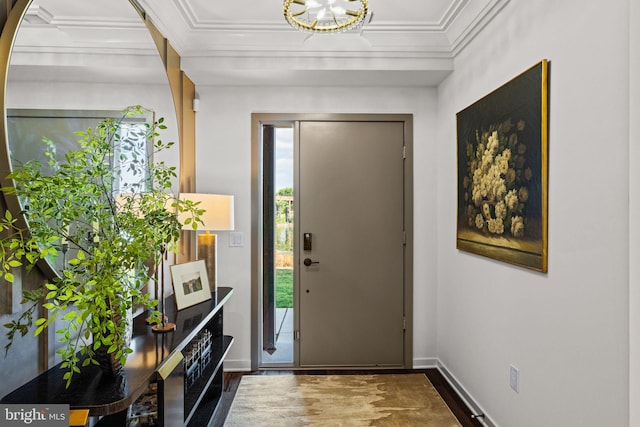 entrance foyer featuring crown molding and dark hardwood / wood-style flooring