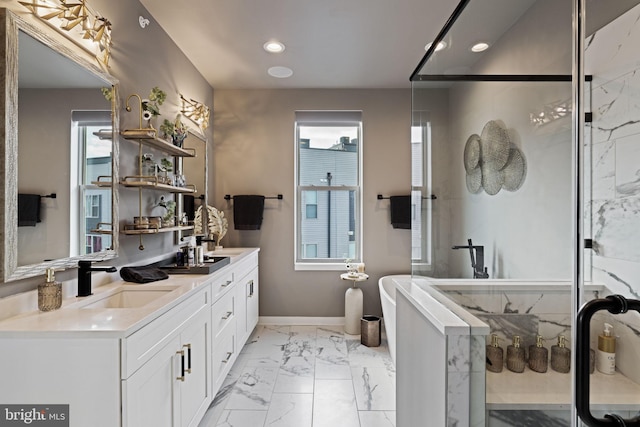 bathroom with vanity and independent shower and bath