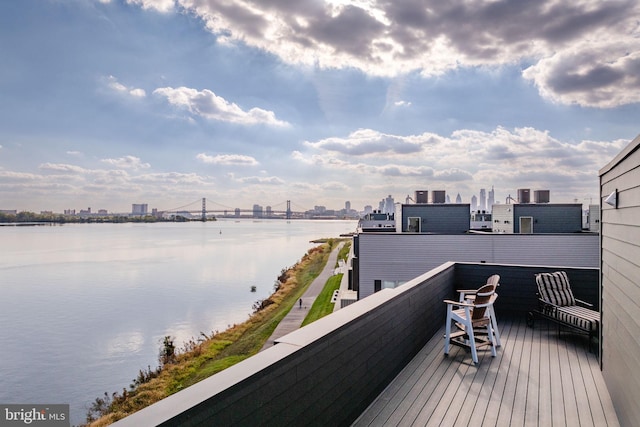 wooden deck featuring a water view