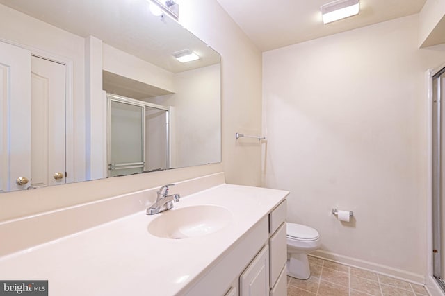 bathroom with vanity, toilet, and walk in shower