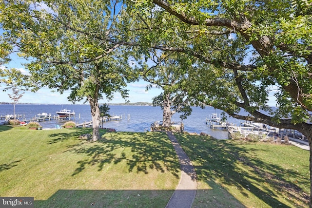 exterior space featuring a water view and a boat dock