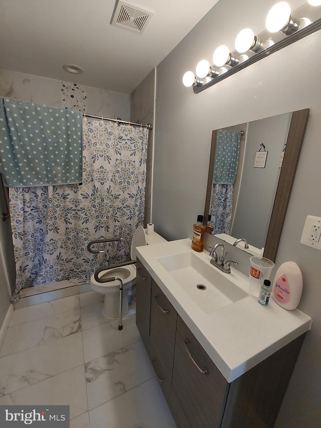 bathroom with vanity, toilet, and a shower with shower curtain