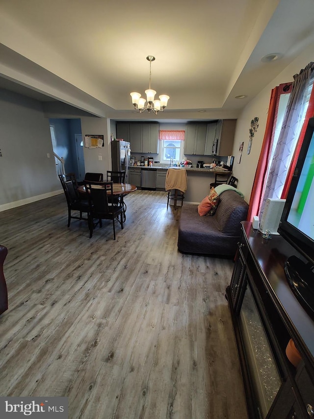 dining room featuring light hardwood / wood-style floors and an inviting chandelier