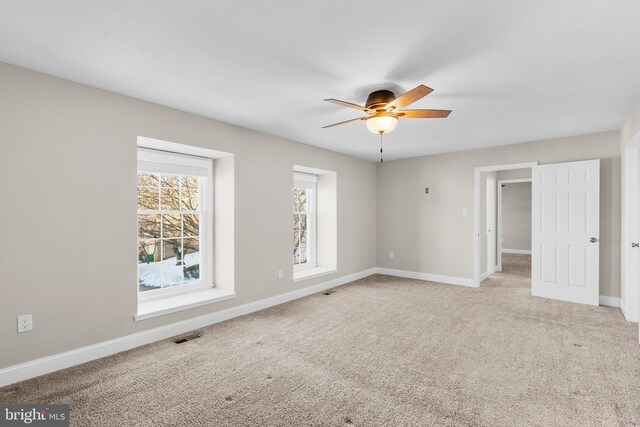 unfurnished bedroom with carpet flooring and ceiling fan