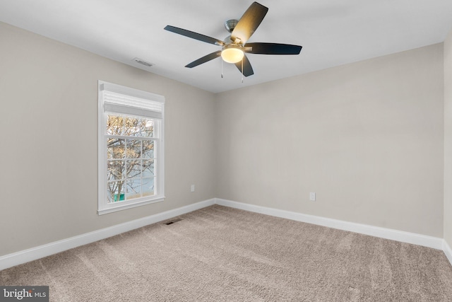 unfurnished room with ceiling fan and carpet floors