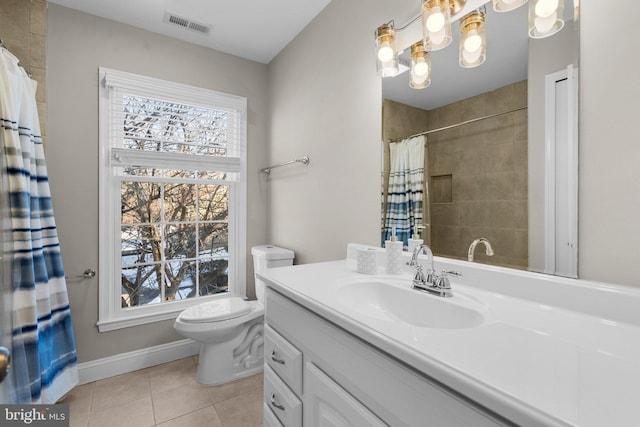 bathroom with toilet, tile patterned flooring, and vanity