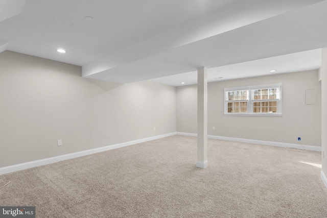 basement with light colored carpet