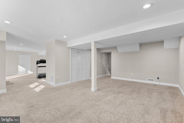 basement with light colored carpet