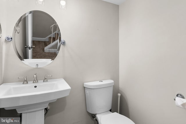 bathroom with toilet and sink