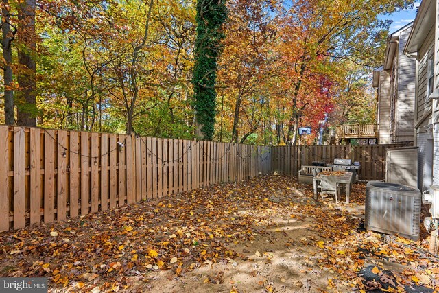 view of yard featuring central AC unit