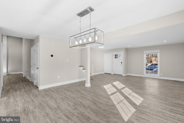 unfurnished living room featuring light hardwood / wood-style flooring