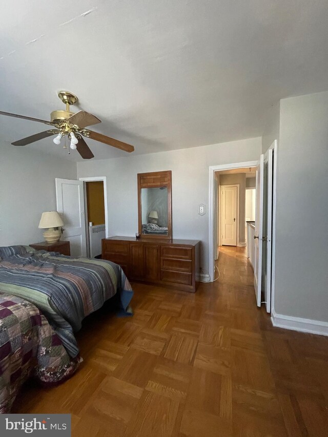 bedroom with parquet flooring and ceiling fan