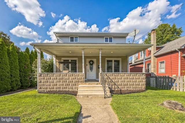 view of front of house featuring a front lawn and a porch