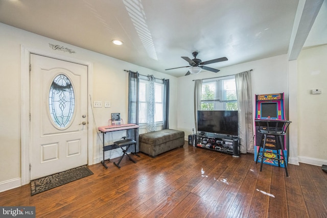 entrance foyer featuring ceiling fan and dark wood-type flooring