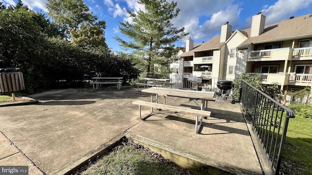 view of patio / terrace featuring a grill and a balcony