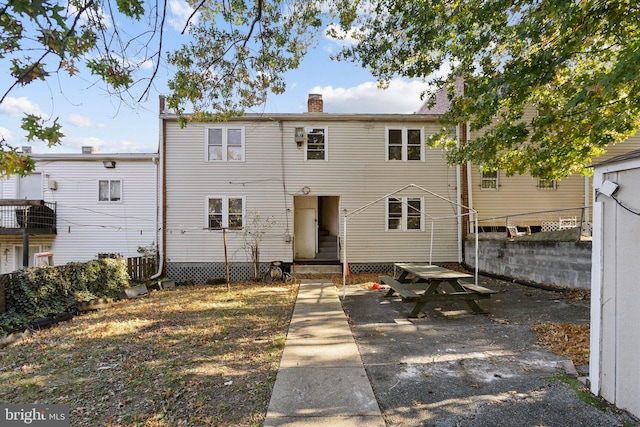 back of property featuring a patio