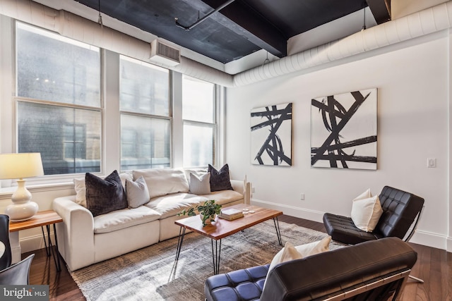 living room with beam ceiling and hardwood / wood-style flooring