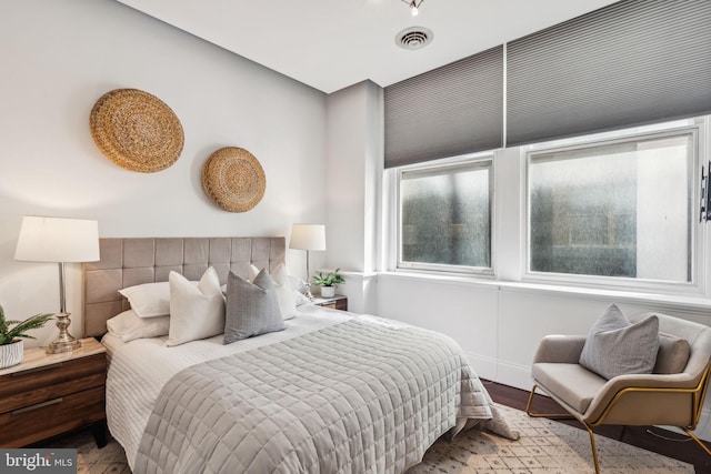 bedroom with wood-type flooring