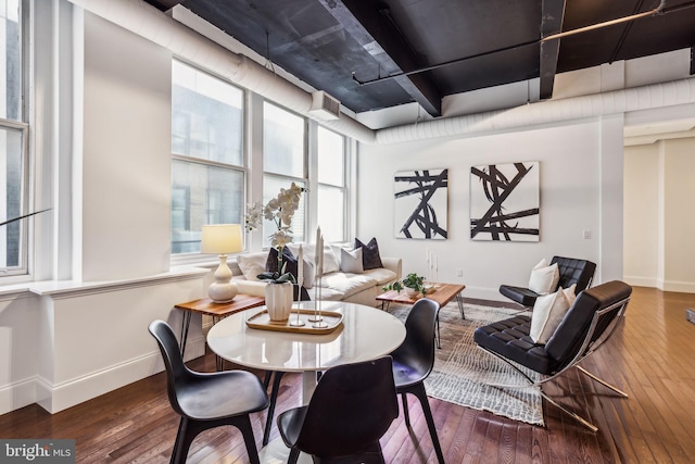 dining area with dark hardwood / wood-style flooring