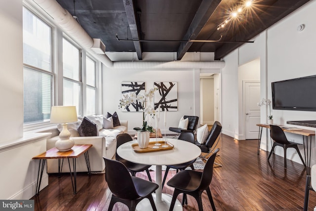 dining area with dark hardwood / wood-style floors