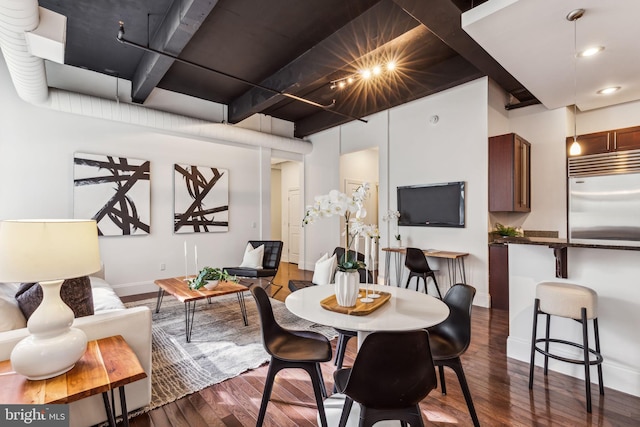 dining room with dark hardwood / wood-style flooring