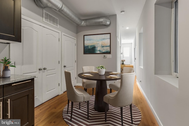 dining space featuring light hardwood / wood-style flooring