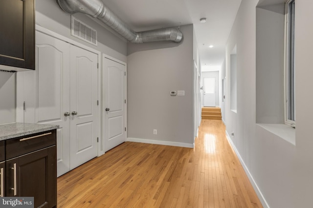 corridor featuring light wood-type flooring