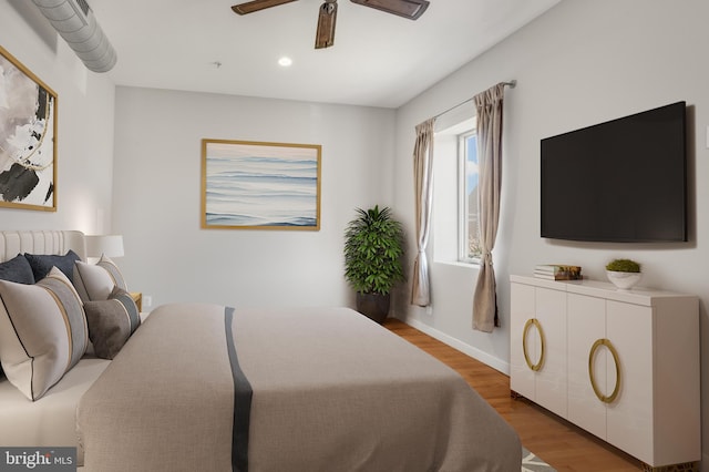 bedroom featuring wood-type flooring and ceiling fan