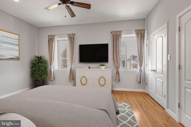 bedroom featuring light wood-type flooring and ceiling fan