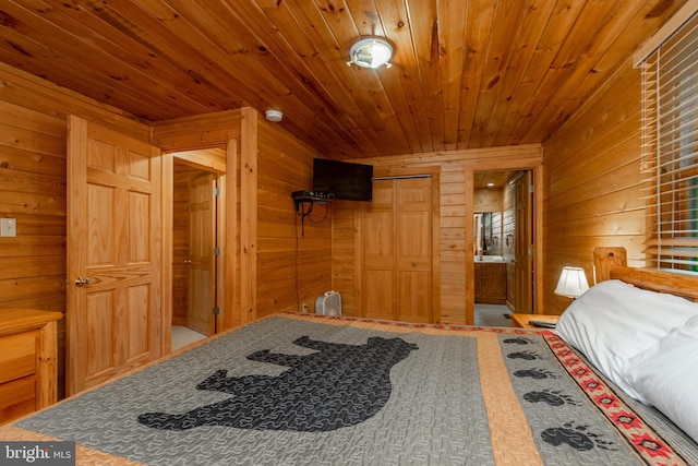 bedroom featuring wood walls, wooden ceiling, and a closet