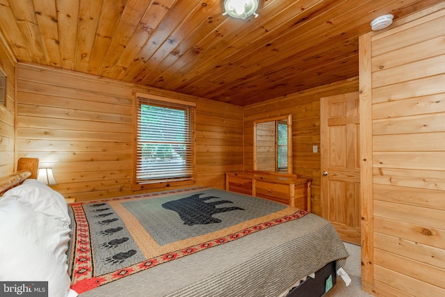 bedroom with carpet, wood walls, and wood ceiling