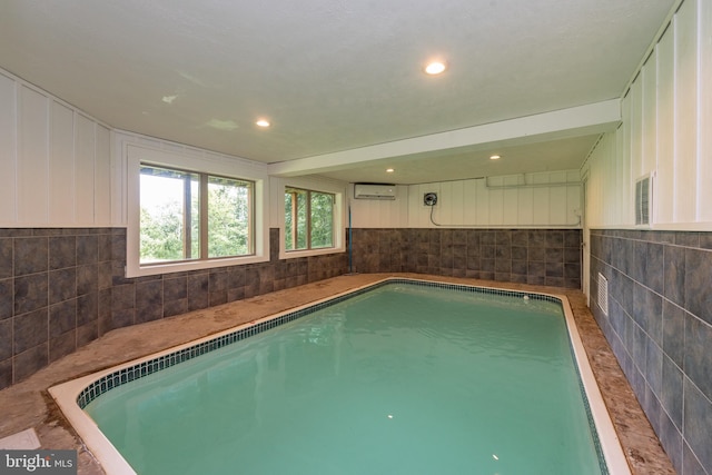 view of swimming pool featuring a wall mounted AC