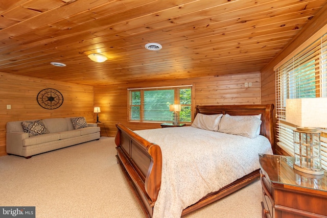 bedroom featuring wood ceiling, wooden walls, and light carpet