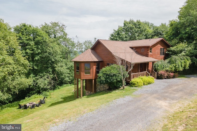116 Wisp Mountain Rd, Mc Henry, MD 21541 - log cabin with a fire pit, driveway, a front yard, roof with shingles, and a porch