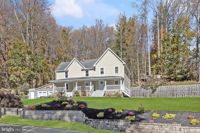 view of front of house with a front yard and a porch