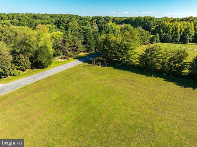 birds eye view of property with a rural view