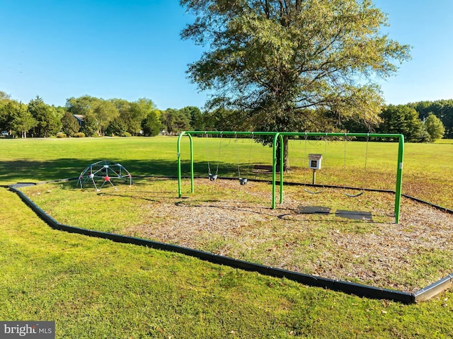 view of community featuring a yard and playground community