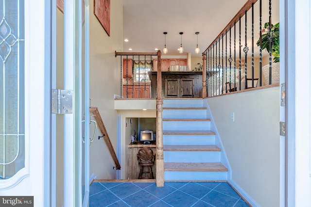 stairs with tile patterned flooring