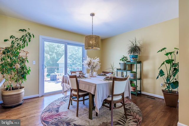 dining area with hardwood / wood-style flooring